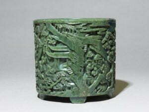 ‘Spinach’ jade brushpot, Qing Dynasty, Qianlong Period, 16.5cm high.Ashmolean Museum, Presented by Mrs Fraser, in memory of her mother Mrs Margaret F. Jenkins, 1967.